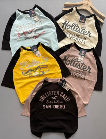 Hollister Co. colorblock logo graphic tees, featuring raglan sleeves and various California-inspired graphic (PACK OF 3)